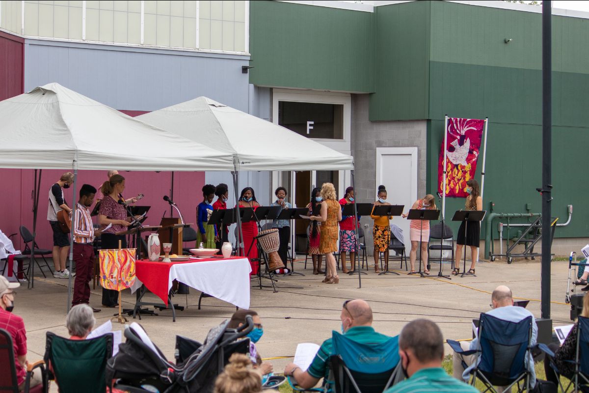 Outdoor COS worship with Swahili choir.jpg